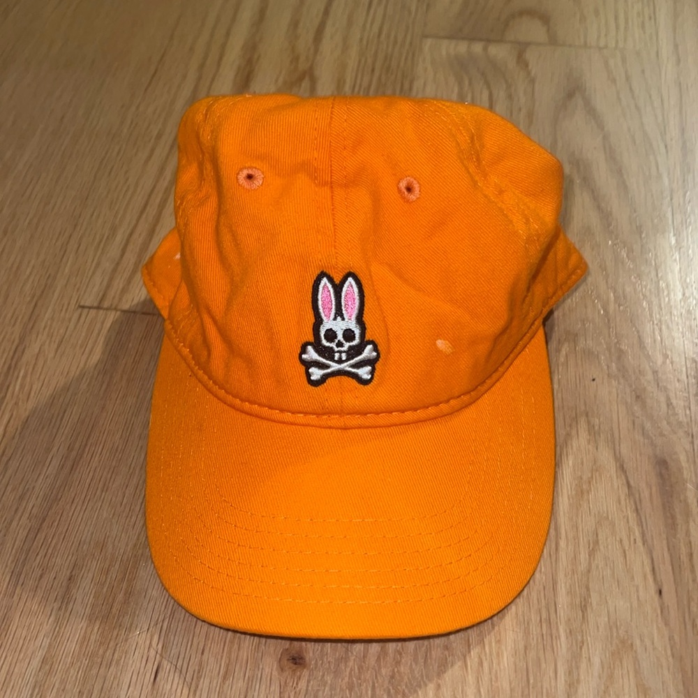 bright orange psycho bunny hat